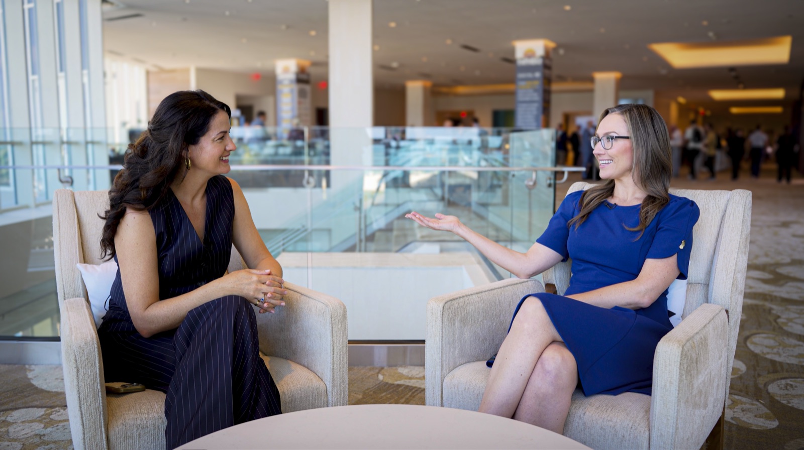Jeanette interviewing an executive at an industry event